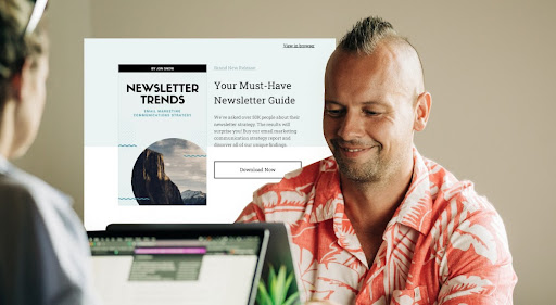 smiling man using laptop